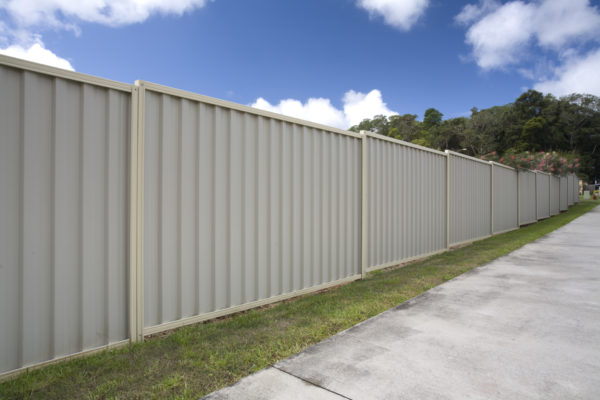 A steel fence in a suburban setting.